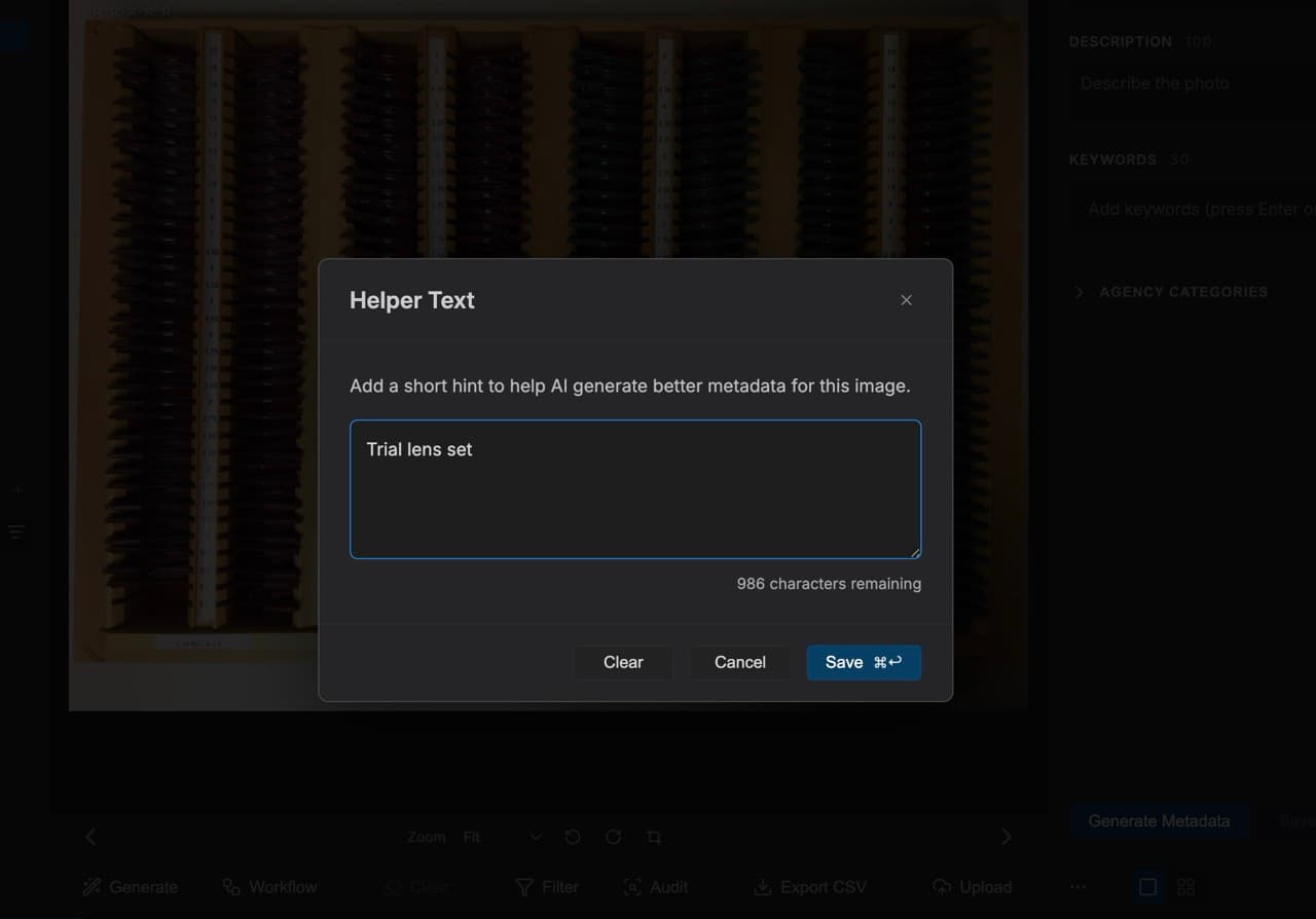 The MetaPhotoAI Helper Text dialog open over a trial lens set image, with the hint 'Trial lens set' typed into the context box before metadata generation. The interface shows description and keyword fields waiting to be filled.